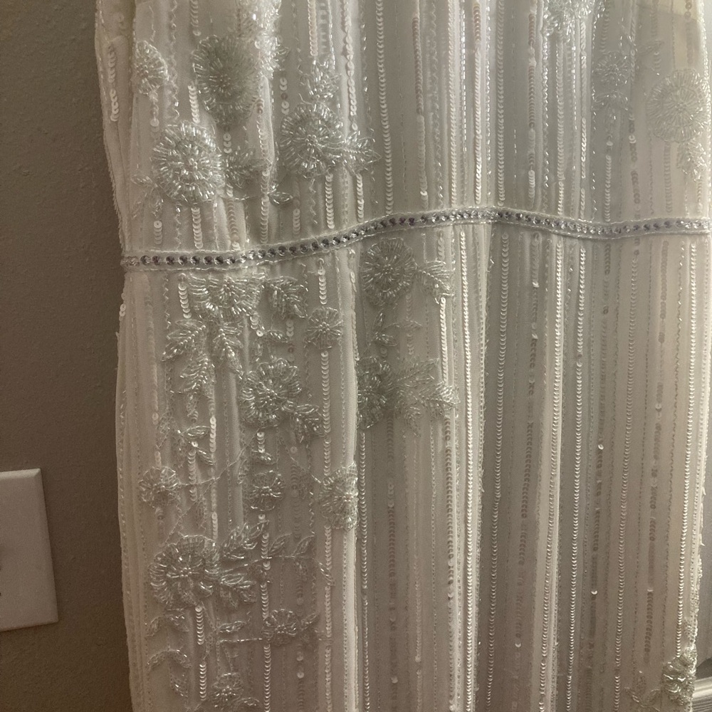 All white Mac Duggal midi dress with crystal and rhinestone embellishments.